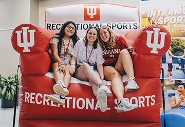 Students sitting in big inflatable chair